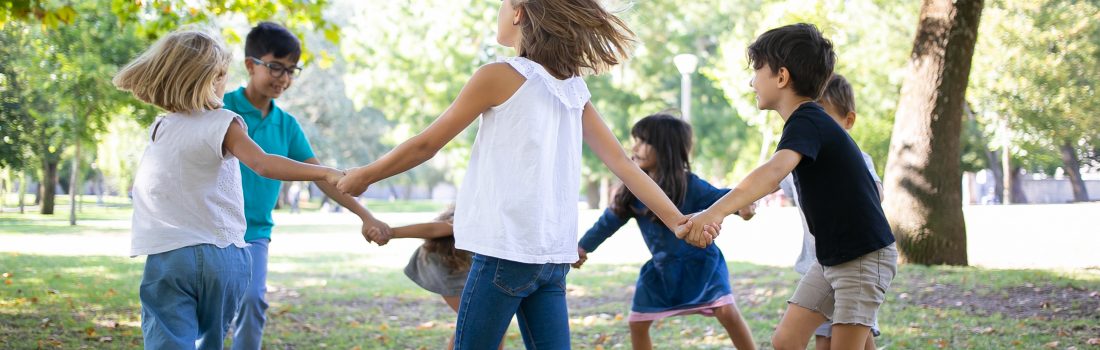 group children holding hands dancing around enjoying outdoor activities having fun park kids party friendship concept - Mütterzentrum e.V. Leipzig